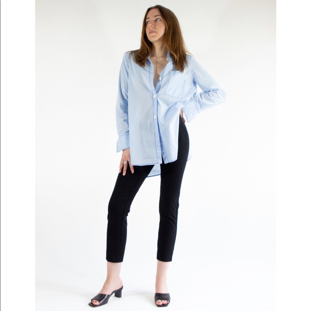 Embroidered button up shirt.